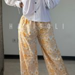شلوار دمپا کمر کشی گلدار نارنجی زنانه HG Lux | کرپ نخ آزاد و فری سایز